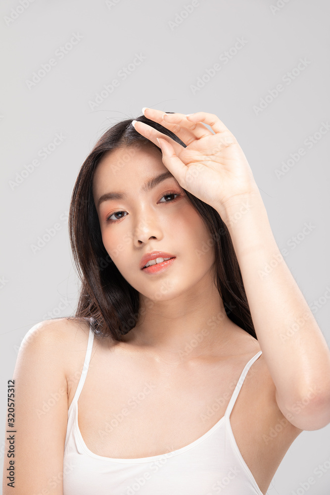 Beautiful Asian woman touching soft cheek smile with clean and fresh skin Happiness and cheerful with positive emotional,isolated on white background,Beauty and Cosmetics Concept Beautiful Asian woman touching soft cheek smile with clean and fresh skin Happiness and cheerful with positive emotional,isolated on white background,Beauty and Cosmetics Concept