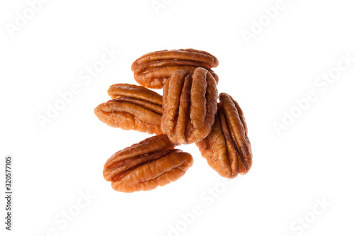 Brown pecan nut isolated on white background. Healthy and diet food.