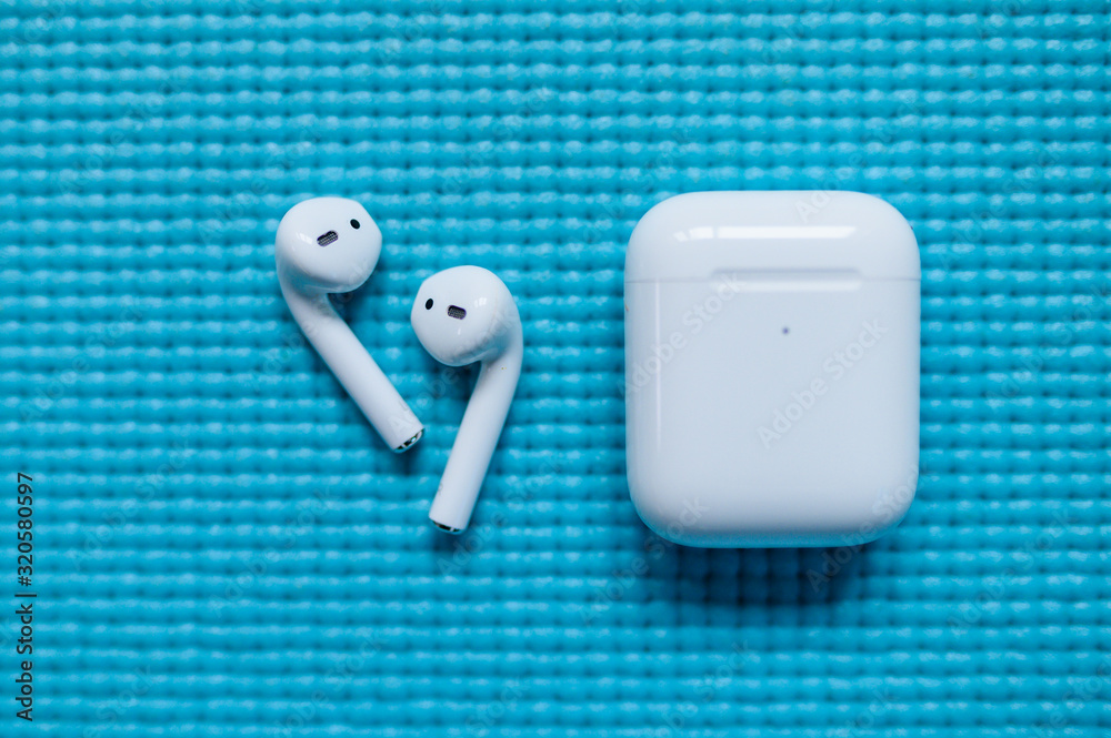 SAN FRANCISCO, USA - FEBRUARY 3, 2020: Apple AirPods Pro, blue background,  wireless Bluetooth earbuds created by Apple. Stock Photo | Adobe Stock