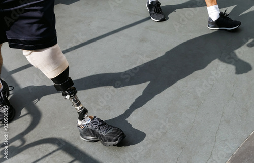 Disabled young man with foot prosthesis