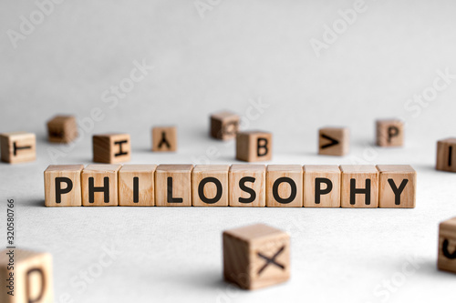 Philosophy - words from wooden blocks with letters, love of wisdom philosophy concept, white background