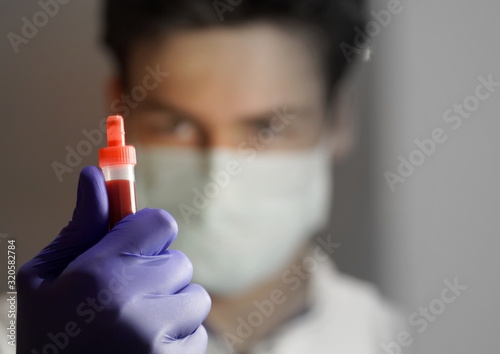 close up of a blood sample in the hand of a laboratory doctor
