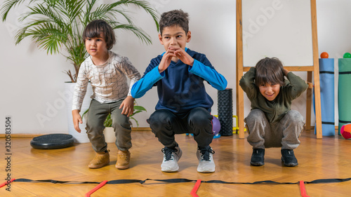 Children Exercising Indoors