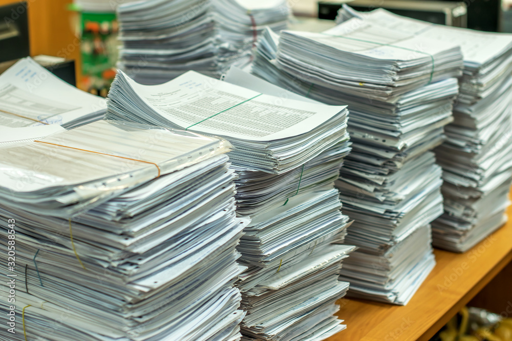 bundles bales of paper documents. stacks packs pile on the desk in the office bundles bales of paper documents. stacks packs pile on the desk in the office