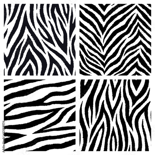 Set of 4 black and white seamless patterns with zebra fur prints. Vector wallpapers. Exotic wild animalistic skin textures.