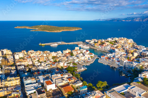 The lake Voulismeni in Agios Nikolaos, a picturesque coastal town with colorful buildings around the port in the eastern part of the island Crete, Greece