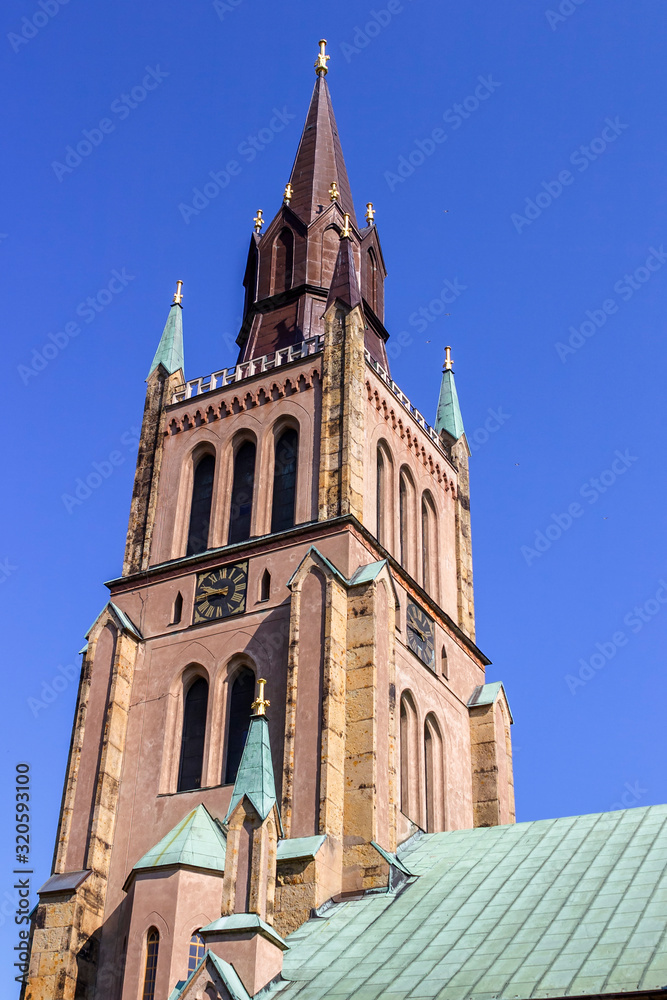 Old church tower against a blue sky