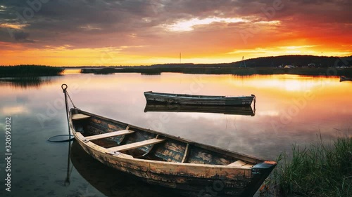 Braslaw Or Braslau, Vitebsk Voblast, Belarus. Wooden Rowing Fishing Boats In Beautiful Summer Sunset On The Dryvyaty Lake. This Is The Largest Lake Of Braslav Lakes. Typical Nature Of Belarus. photo