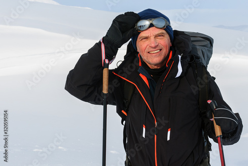 portrait of a nordic skier. Active retirement of a person. Cross-country skiing trip in Norway