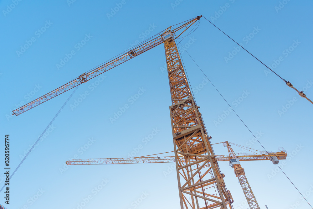 Construction site with high-rise construction cranes. Construction site with high-rise construction cranes.