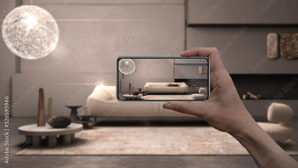 Hand holding smart phone, AR application, simulate furniture and interior design products in real home, architect designer concept, blur background, grunge lounge with plaster walls - obrazy, fototapety, plakaty 