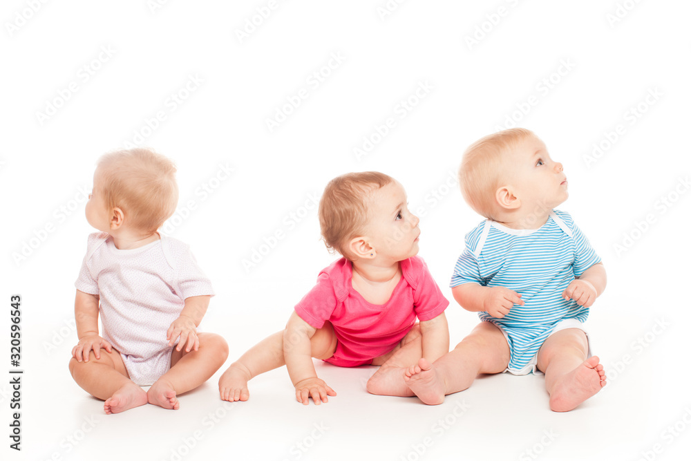 Little babies are playing over white background Little babies are playing over white background