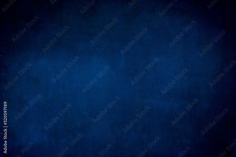 Dark blue grungy backdrop or texture
