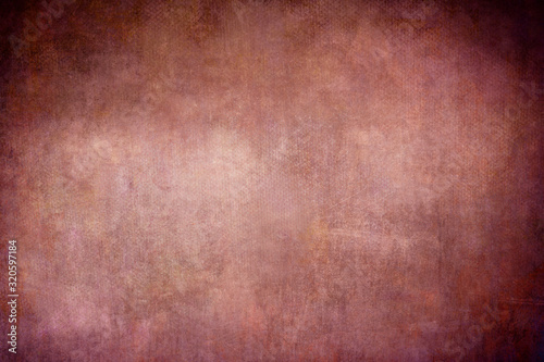 Reddish colored grungy backdrop or texture