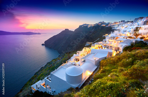 Fira town on Santorini island, Greece. Incredibly romantic sunset on Santorini. Oia village in the morning light. Amazing sunset view with white houses. Island lovers