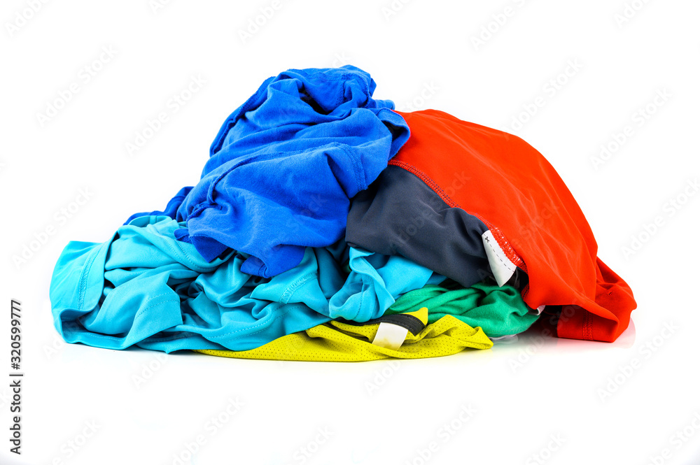 Pile of colorful dirty cloths for laundry isolated on white background