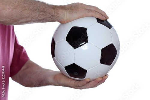 holding a soccer ball in hands