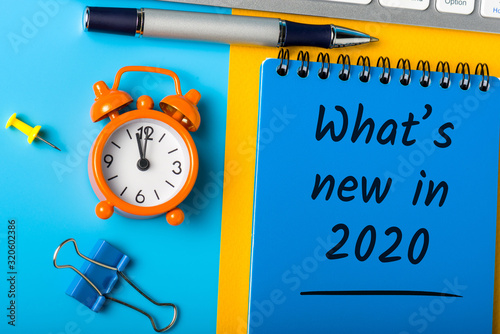 A note What's new in 2020 year. Changes coming in 2020. With office or school supplies photo