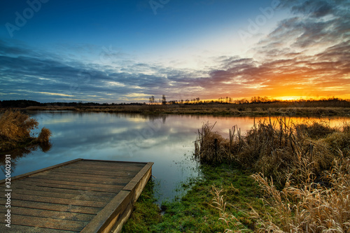 Fototapeta Naklejka Na Ścianę i Meble -  Beautiful sunrise over river banks
