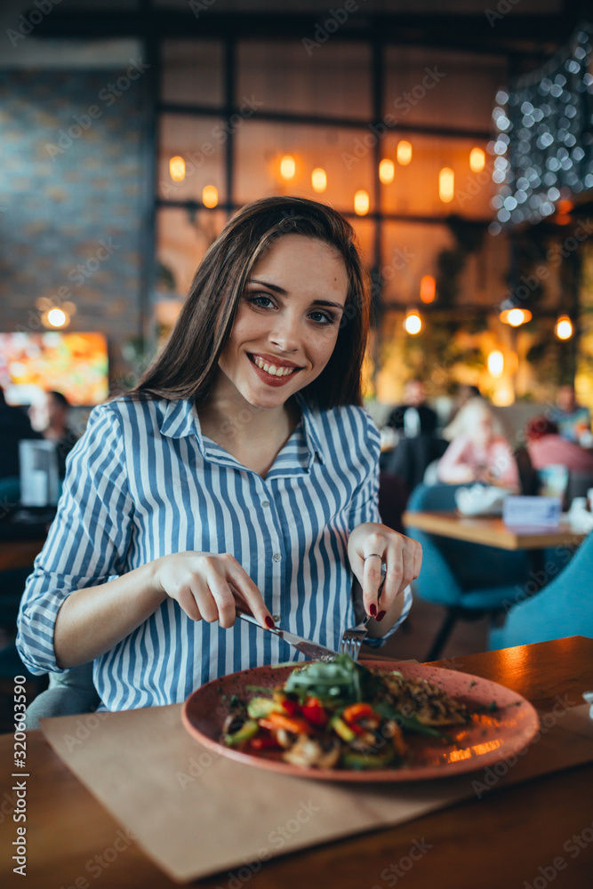 woman in restaurant having lunch