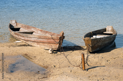 Boats moored on the lake shore. photo