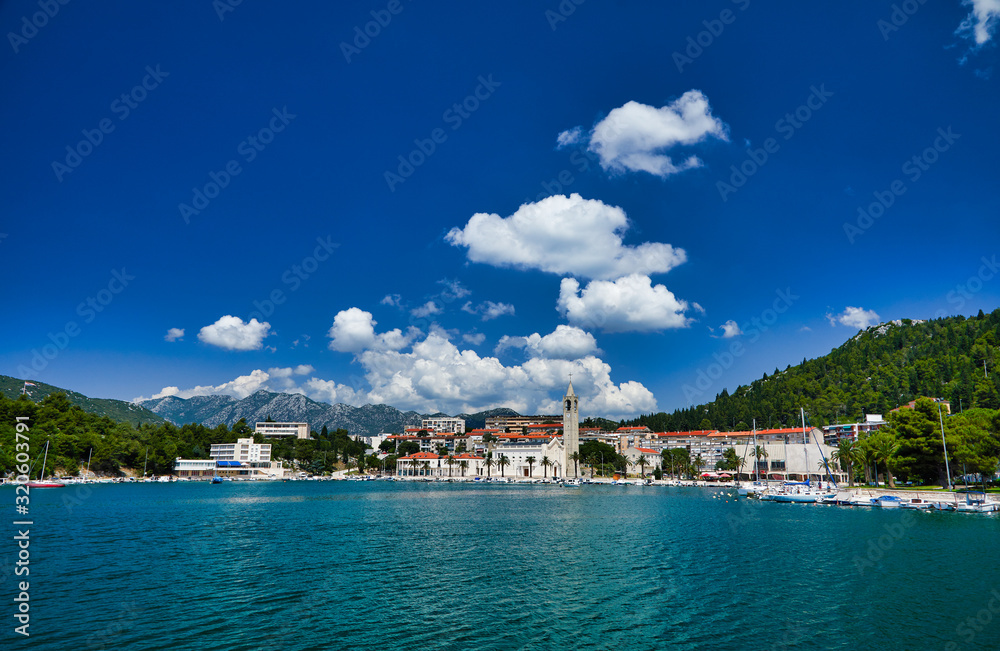 View of Ploce Tower. Sunny summer cityscape of Ploche city, Croatia, Europe. Bright morning seascape of Adriatic sea. Beautiful world of Mediterranean countries. Architecture traveling background..