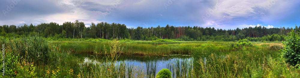 landscape panorama with lake and blue sky
