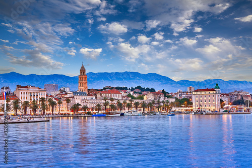 Split, Croatia. View of Split - the second largest city of Croatia at night. Shore of the Adriatic Sea and famous Palace of the Emperor Diocletian. Traveling concept. Mediterranean countries. photo