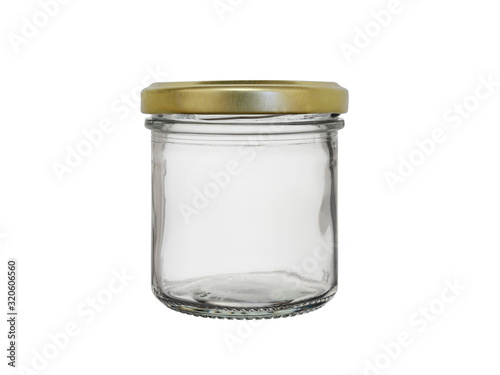 Empty glass jar for canned food, closed with a metal lid. Isolated on a white background