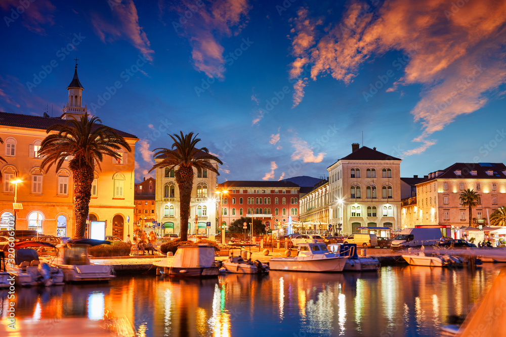 Split, Croatia. View of Split - the second largest city of Croatia at night. Shore of the Adriatic Sea and famous Palace of the Emperor Diocletian. Traveling concept. Mediterranean countries.