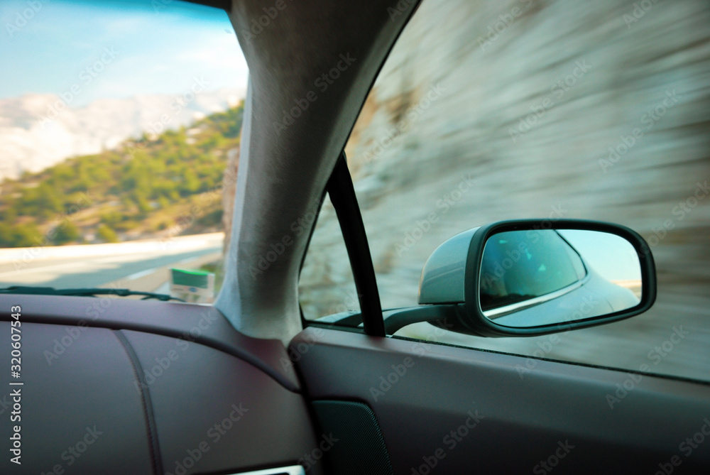 Picture showing the speed of a sports car cornering taken from inside