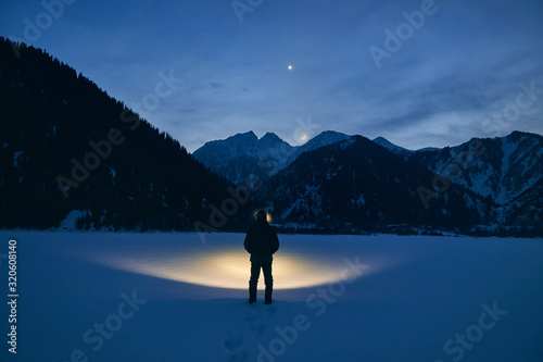 Man on the mountains at night © pikoso.kz