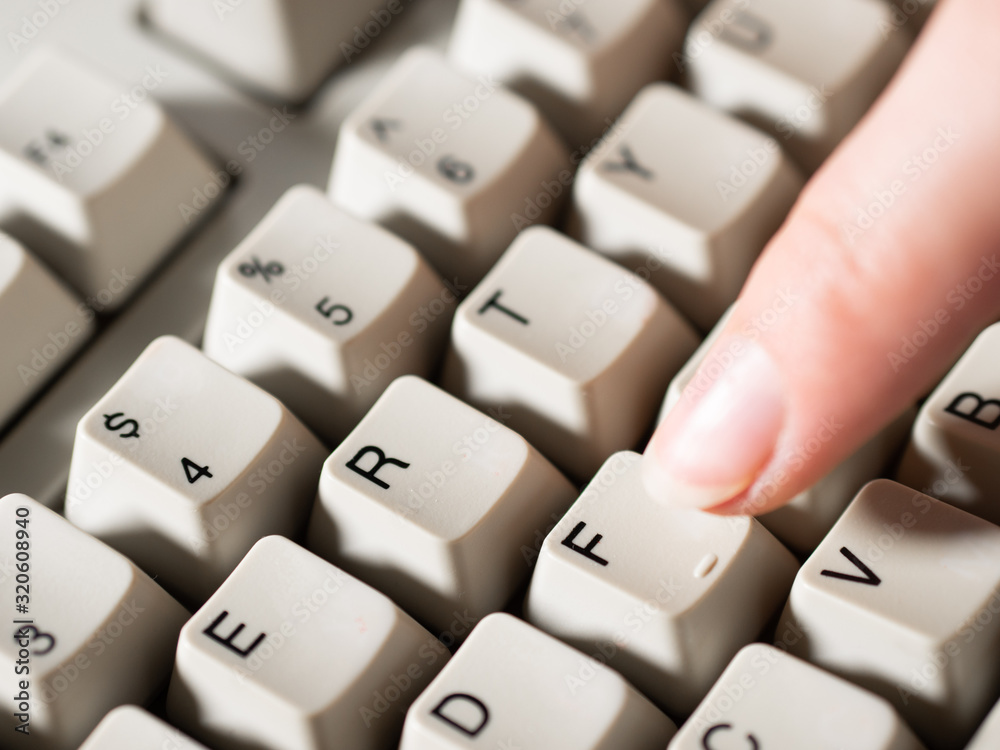 Female forefinger pushes F button. Close-up Female forefinger pushes F button. Close-up