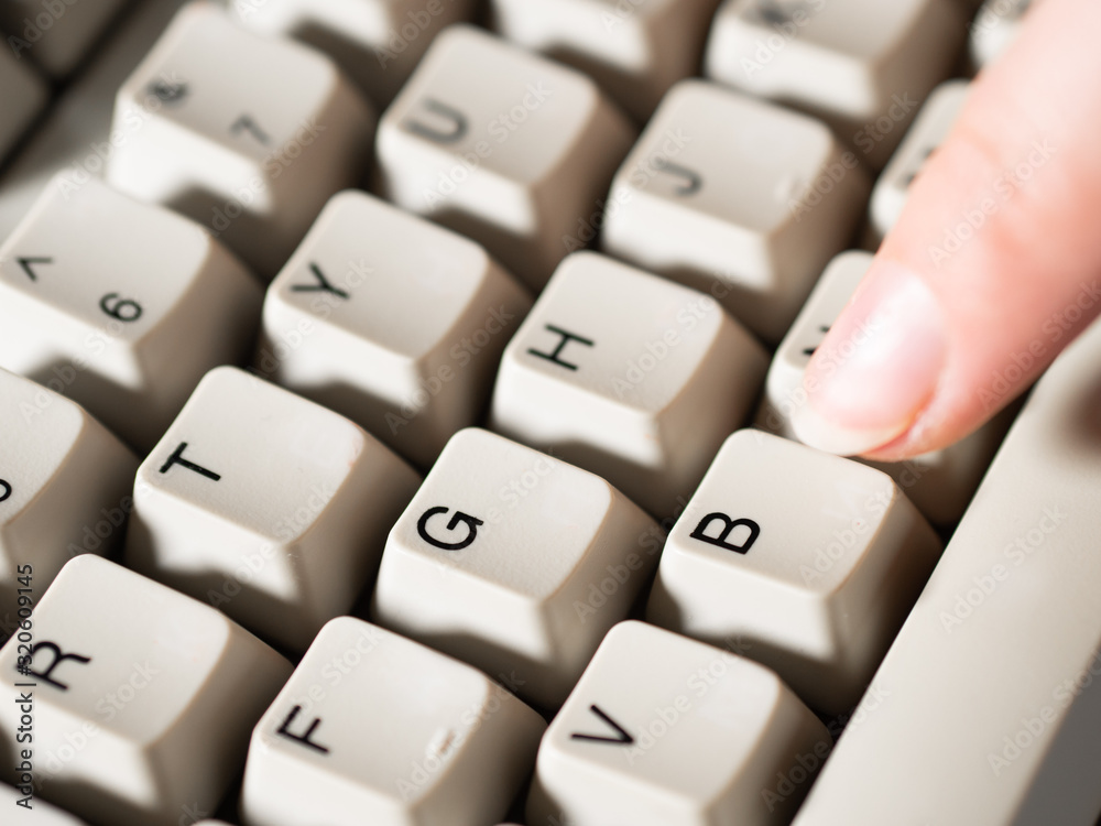 Female forefinger pushes B button. Close-up Female forefinger pushes B button. Close-up