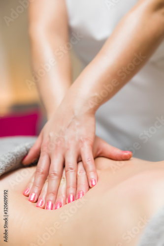 Woman having an professional massage of the abdomen