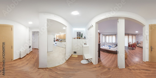 360 equirectangular photography, of the entrance of a flat, in the passage, all the rooms are seen photo