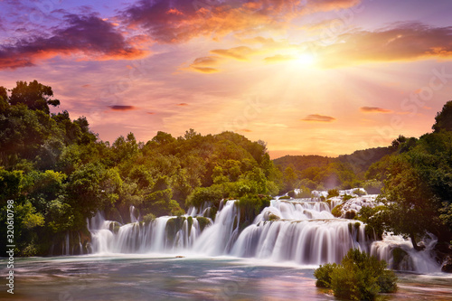 Beautiful Skradinski Buk Waterfall In Krka National Park - Dalmatia Croatia, Europe. Beautiful long exposure panorama of waterfalls (milk effect). A true natural wonder. Amaizing sunlight view. photo