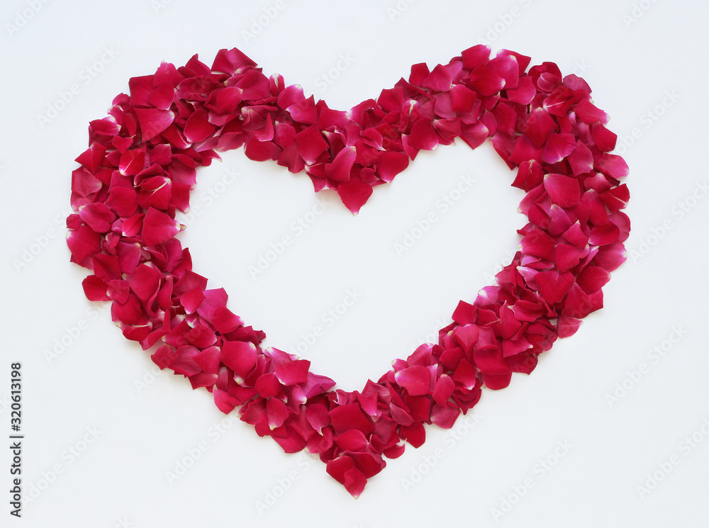 Heart of red rose petals. Valentine heart dekoration.