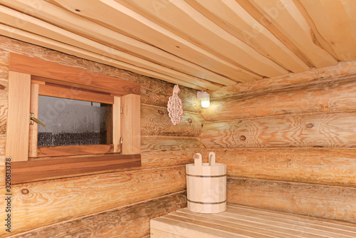 The interior of a wooden bathhouse from a log house