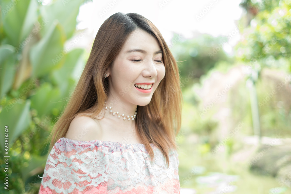 portrait beautiful asian woman smiling against green tree nature background portrait beautiful asian woman smiling against green tree nature background