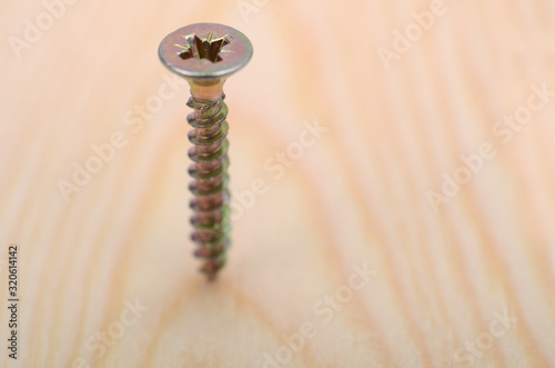 Stainless Steel  Wood Screws in use, screwing screw into a wood.