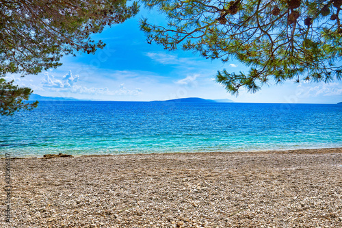 Amazing seascape of Adriatic sea. Luchica beach Croatia, Europe. Colorful summer view of small beach. Croatian coast with clear water and pine trees around. Tropical viewpoint for design postcard.