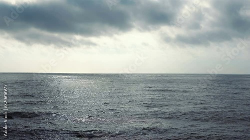 Dark calm sea and sky in the evening. Beautiful sea background, aerial view. Mediterranean sea.
