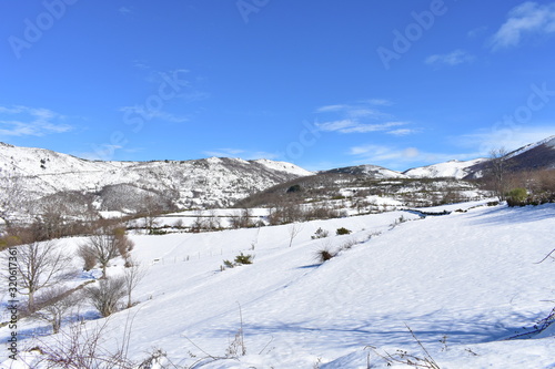 Winter landscape with white snowy mountains and blue sky. Piornedo, Ancares, Lugo, Galicia, Spain.