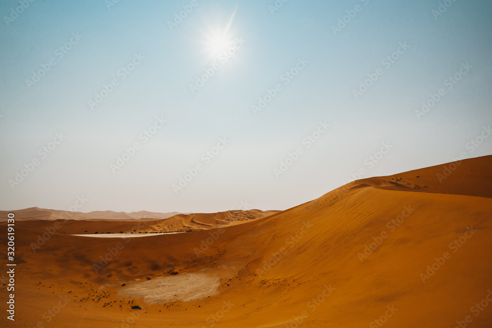mesmerising wide photo of a beautiful sand dunes at Sossusvlei in Namib Desert