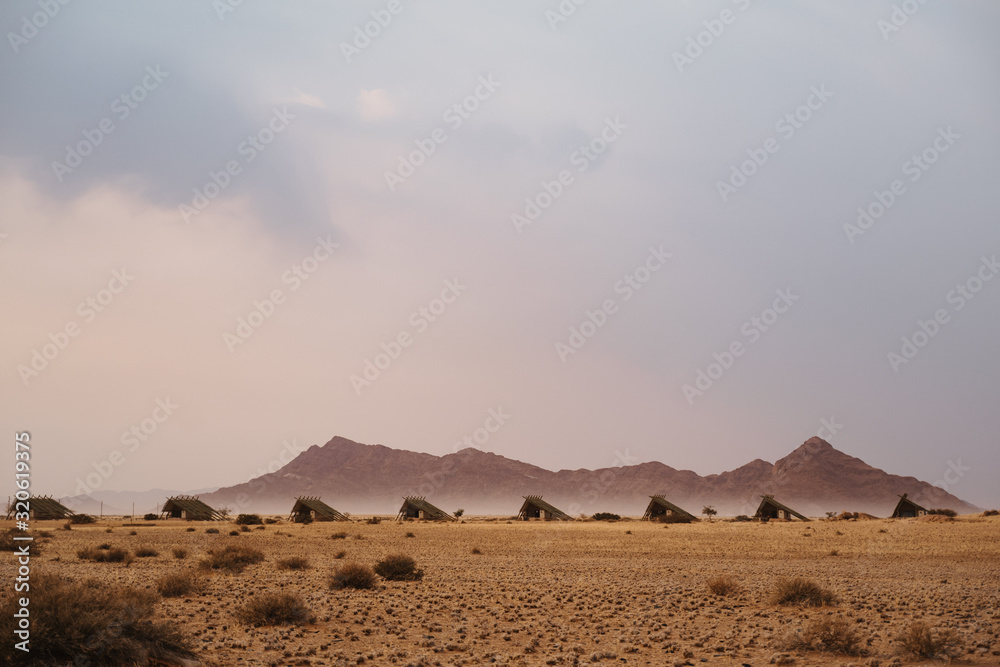 small chalets of desert lodge at Namib-Naukluft National Park