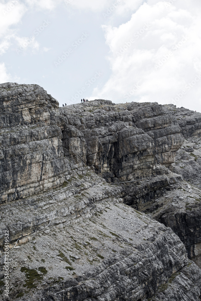 Hiking Dolomites mountains of Passo Giau. Peaks in South Tyrol in the Alps of Europe. On the edge Hiking Dolomites mountains of Passo Giau. Peaks in South Tyrol in the Alps of Europe. On the edge
