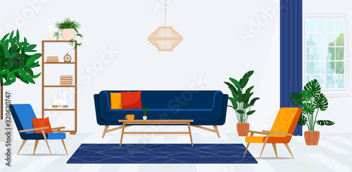 Retro armchairs and colorful pillows on a navy blue sofa in a vibrant living room interior with green plants. 