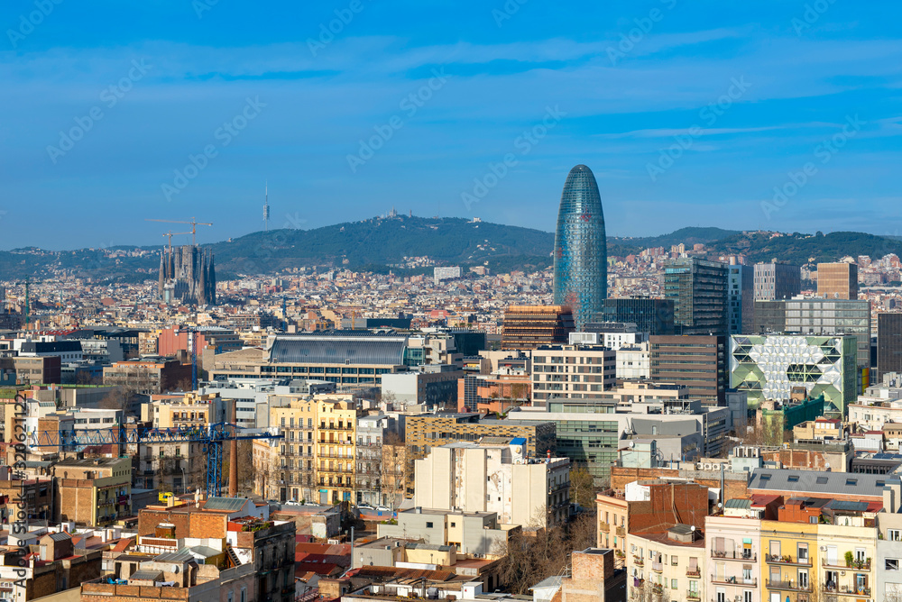 Panorama of Barcelona.  Aerial view of the city from the Poblenou district with Akbar tower and Sagrada Familia Cathedral.