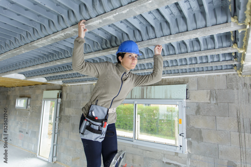 woman builder thinking of renovating new apartment
